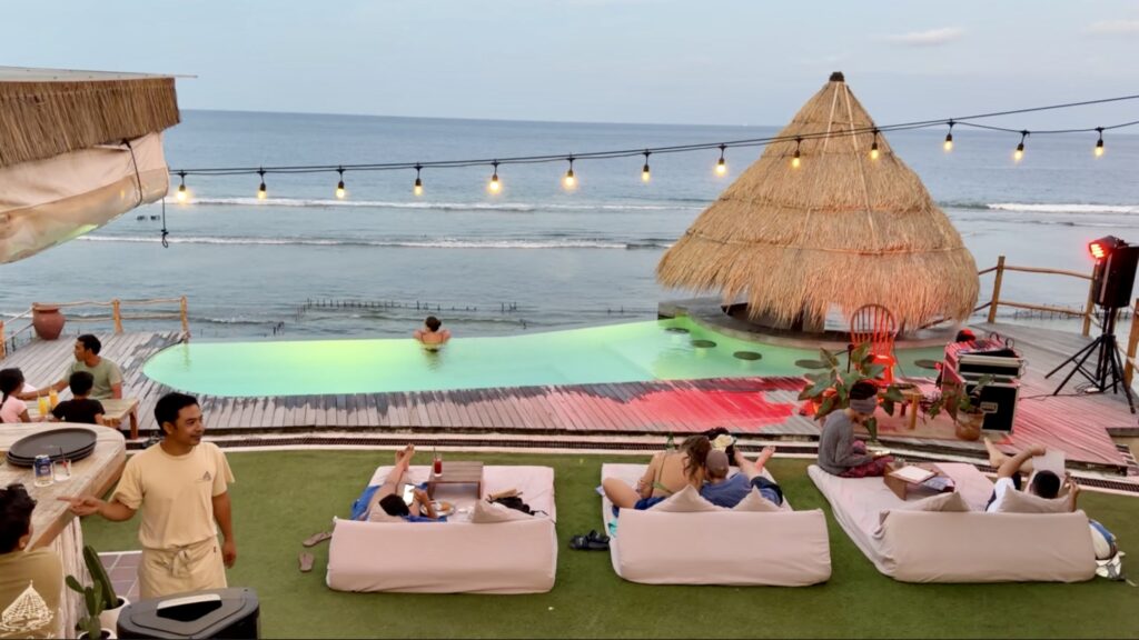 as sunset, the view from the stairs out onto the infinity pool at The Chill Penida