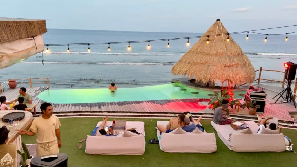 as sunset, the view from the stairs out onto the infinity pool at The Chill Penida