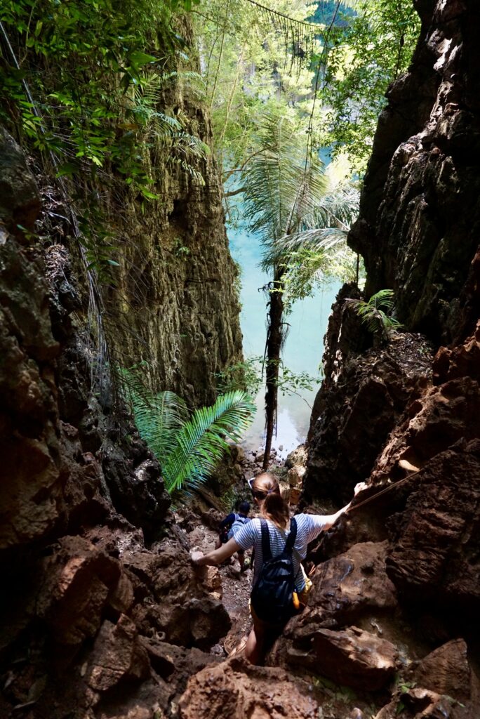 climbing down to the blue lagoon in railay thailand