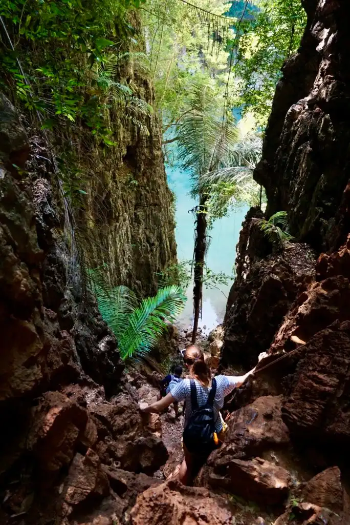 climbing down to the blue lagoon in railay thailand