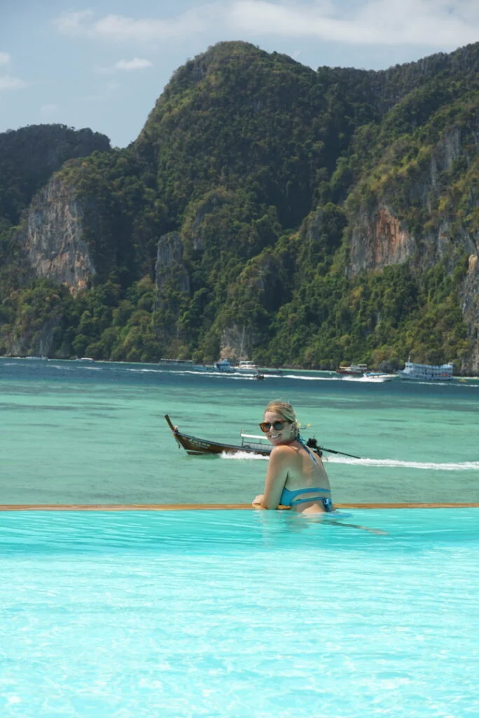 emily sitting on the edge of the infinity pool at Phi Phi Don Chuckit